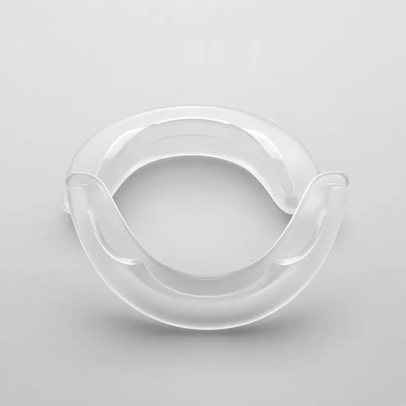 Reference photo of a pair of C-shaped plastic dental cheek retractors