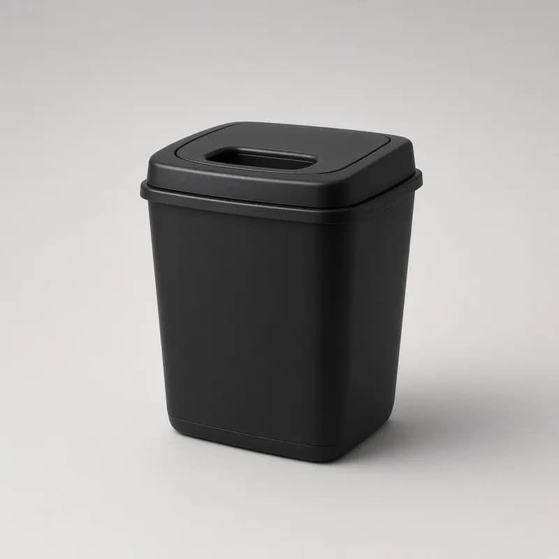 Reference photo of a small car trash bin with a lid