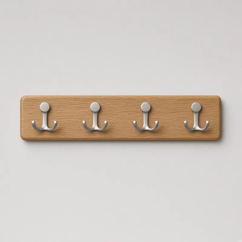 Reference photo of a wooden wall coat rack with four hooks